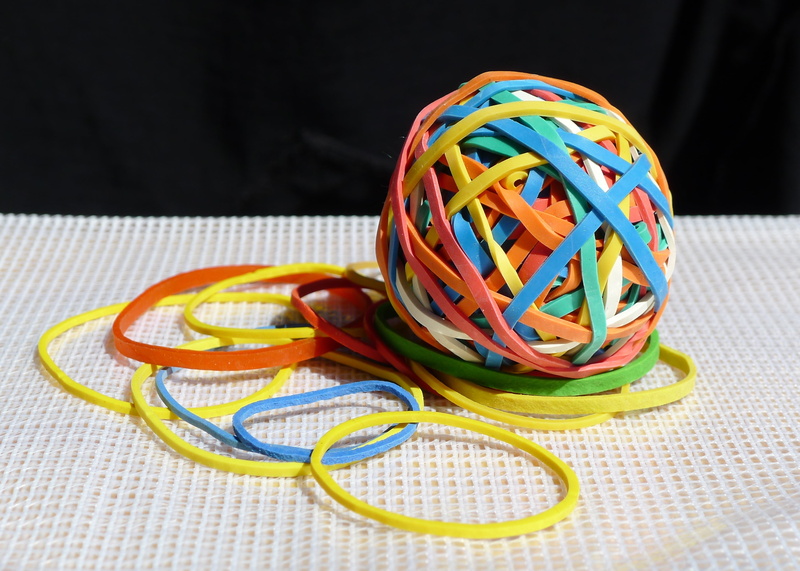 orange color, electrical equipment, complexity, band, tangled, rubber band, elastic, multi colored, office supplies, bonds, indoors, round, intertwined