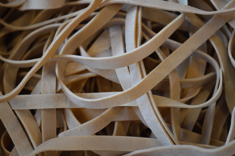postman, metal, no people, close-up, 5K, brown, still life, design, office, elastic, selective focus, post, high angle view, backgrounds, indoors, pattern