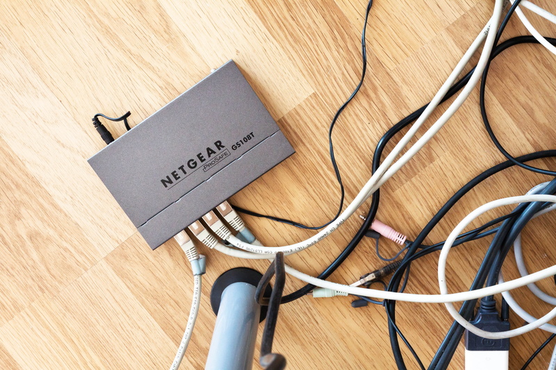 still life, communication, high angle view, modem, network connection, electricity, netgear, flooring, parquet, text, wireless, office, table, hardwood floor