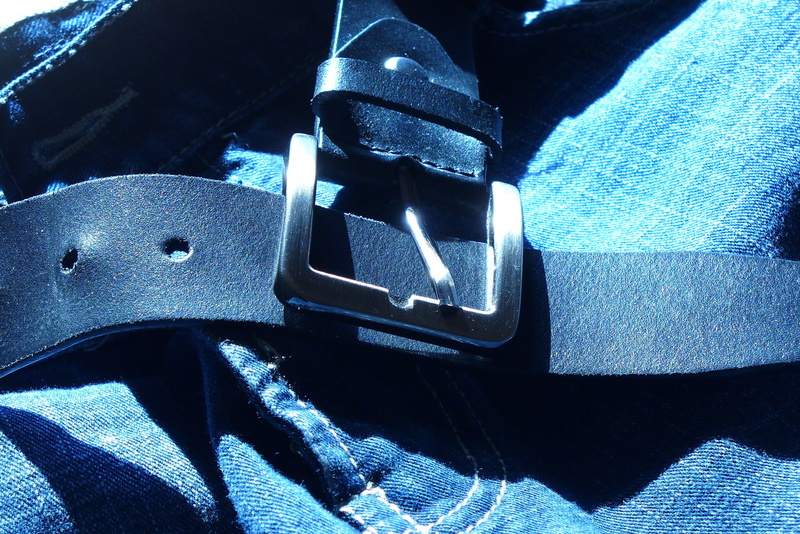 close-up, garment, sign, still life, seat belt, wear, car, clothing, textile, motor vehicle, luxury, bottoms, fashion, buckle, strap, accessory, denim