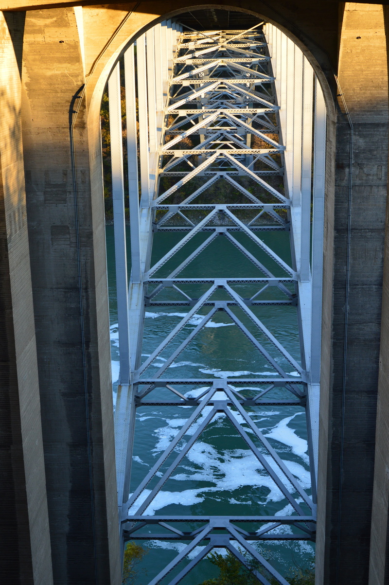 outdoors, bridge, transit, road, architectural, metal, built structure, architecture, landmark, overpass, glass - material, river, underneath, exterior