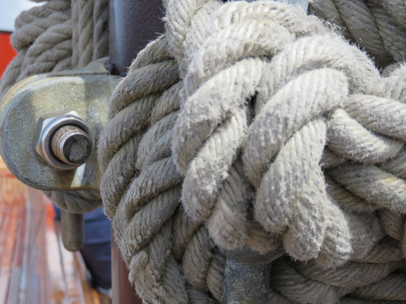 tied, sailboat, rigging, maritime, strength, marine, no people, transportation, wheel, textile, rolled up, twisted, outdoors, spiral, textured, connection