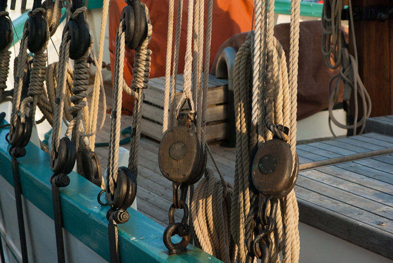 rigging, close-up, tied up, pulley, brown, wheel, fishing industry, focus on foreground, equipment, boat, harbor, fishing boat, outdoors, deck, sunlight