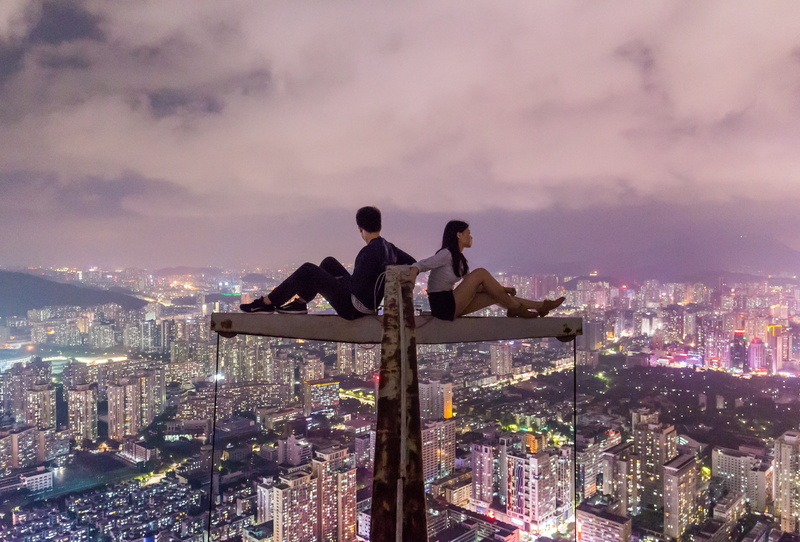 couple - relationship, adult, urban, building exterior, cloud - sky, people, lights, young adult, overview, office building exterior, modern, togetherness