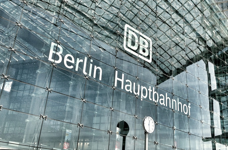 day, building exterior, outdoors, 1080P, communication, travel, logo, no people, central station, building, information sign, built structure, low angle view