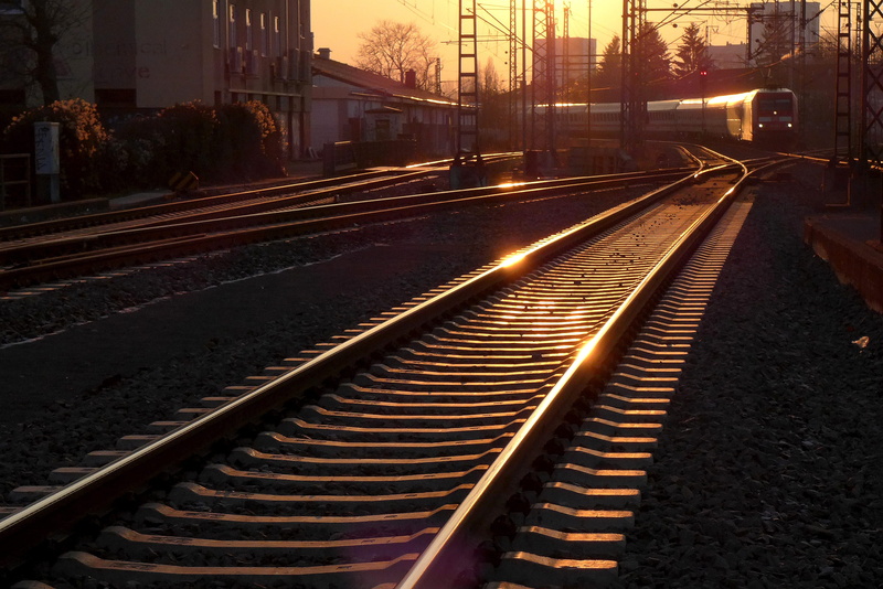 street, outdoors, metal, railroad track, direction, transportation, rails, sky, illuminated, night, track, built structure, train, railroad tracks, railway