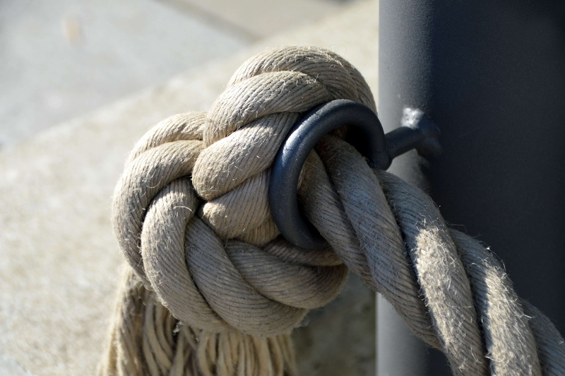 focus on foreground, aggression, hemp, fixing, close up, no people, material collection, barrier, graphic, outdoors, post, alloy, day, close-up, ship traffic jams