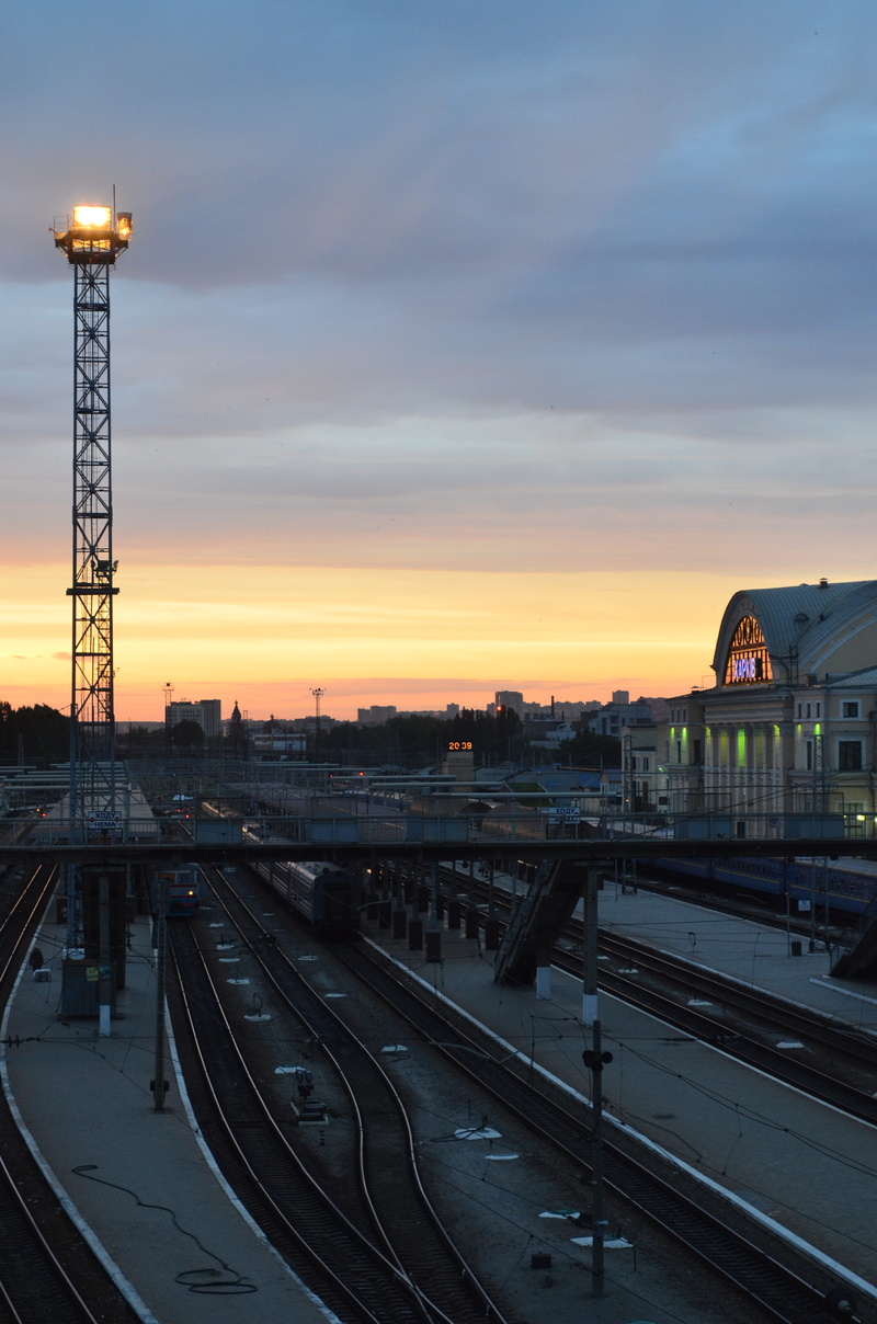 orange color, rails, composition, train, station, road, railway, outdoors, stand by, evening, built structure, sky, dusk, cloud - sky, street, track, sunset