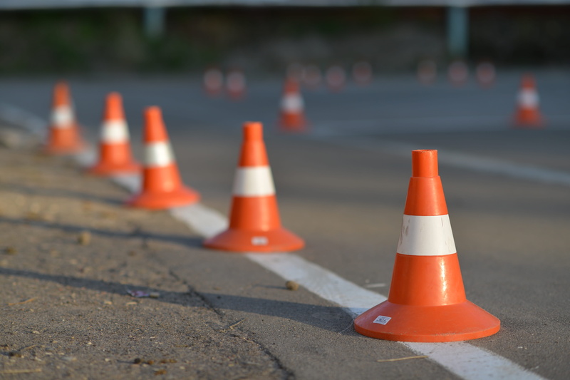 warning sign, guidance, the markup, sign, cone, day, road warning sign, rules, post, transportation, Markup, orange color, city, focus on foreground, Orange