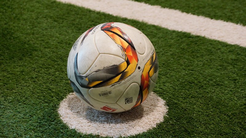 soccer ball, team sport, high angle view, line, yard line - sport, sunlight, kick, green color, no people, 5K, day, sport, football, ball, close-up, pitch