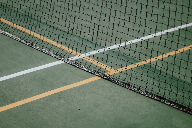 nature, sunlight, playing field, 4K, fence, white, sports, empty, yard line - sport, green color, lines, outdoors, net - sports equipment, boundary, day