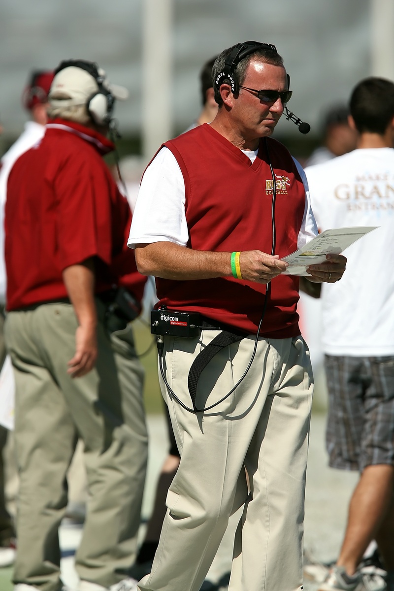 standing, uniform, texan, sport, coach, american football field, coaching, focus on foreground, real people, holding, clothing, sideline, football american