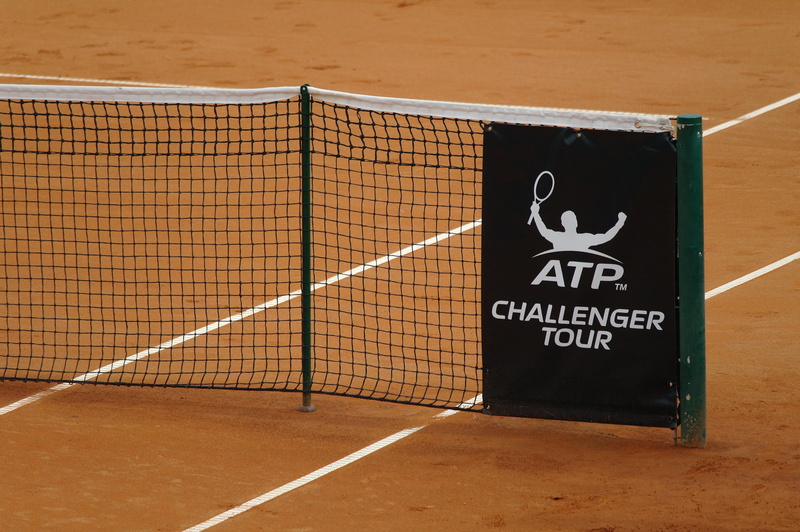 sport, net, outdoors, human representation, tennis net, western script, communication, clay court, shadow, absence, tennis, atp, container, wall - building feature