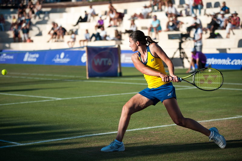 motion, shorts, tennis ball, ball, healthy lifestyle, spectator, effort, teenager, skill, tennis court, tennis racket, woman, competition, gras, court