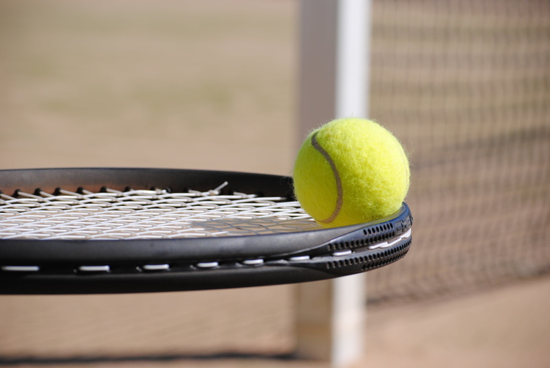 recreational pursuit, competition, nightlife, ball, no people, close-up, black, two objects, racket, bat, focus on foreground, racket sport, yellow, tennis court