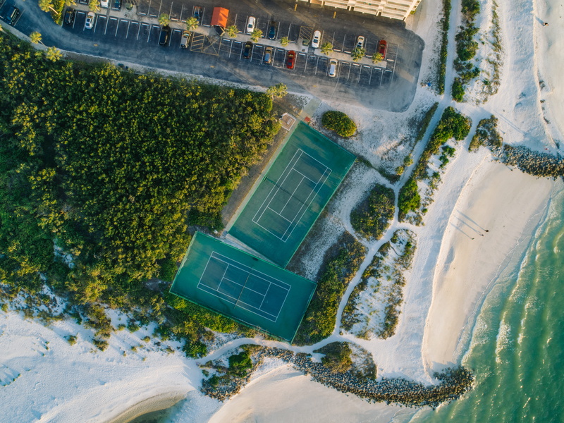 water, tennis, building exterior, beach, city, built structure, outdoors, building, land, tree, courts, 4K, sand, no people, nature, luxury, swimming pool