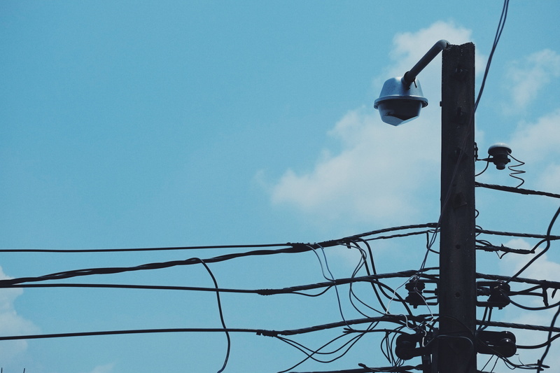 sky, street light, outdoors, day, nature, electricity, pole, technology, lighting equipment, telephone line, blue, fuel and power generation, cable, the power cord