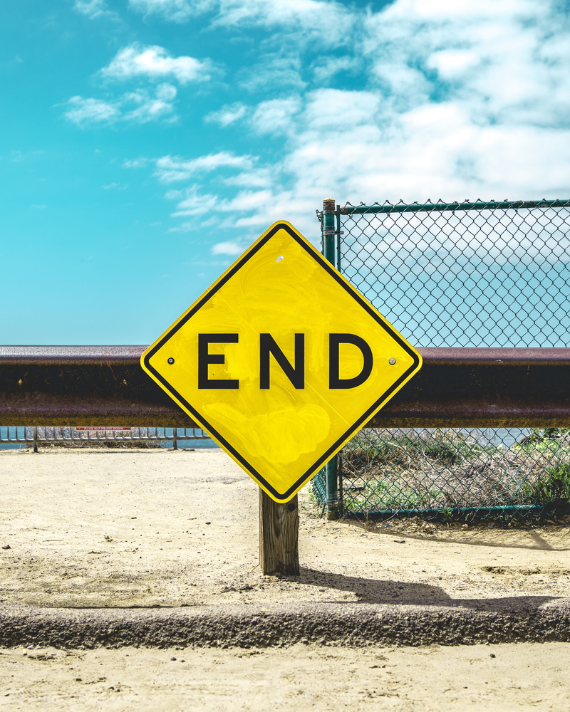 warning sign, information sign, sign, sand, cloud - sky, fence, end, road, post, capital letter, safety, guidance, beach, sky, guardrail, signage, yellow