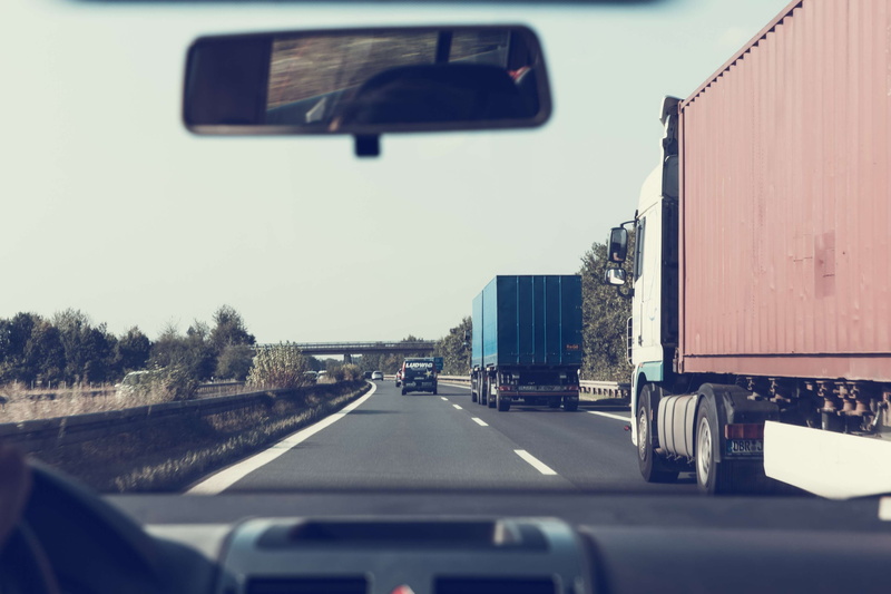 way, expressway, roadway, street, reflection, rearview mirror, car interior, no people, on the move, trucks, nature, vehicle interior, glass - material