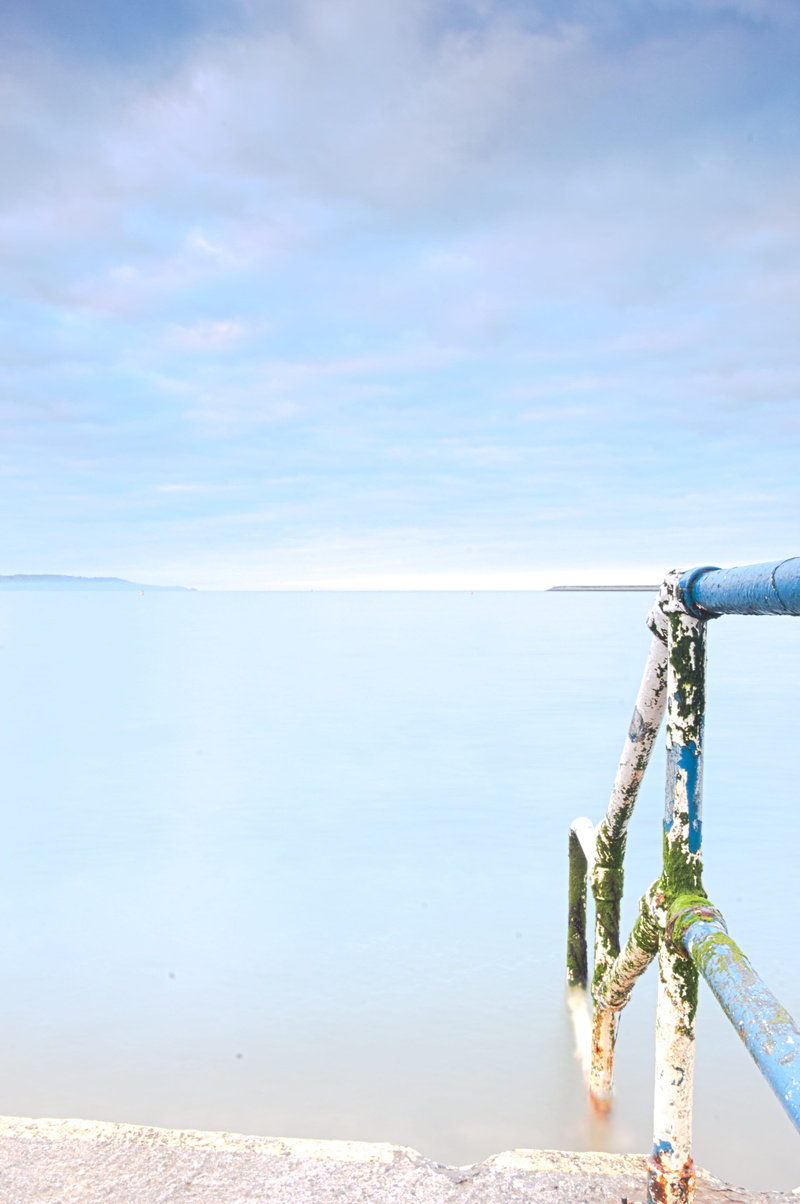 guardrail, sky, day, beauty in nature, no people, blue, water, horizon, cloud - sky, seapoint beach, ireland, nature, horizon over water, scenics - nature