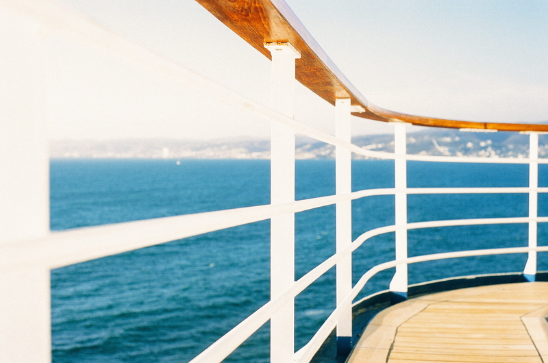 vacations, journey, sunlight, cruise, sea, sky, holiday, travel destinations, tranquility, horizon over water, tranquil scene, guardrail, wood, outdoors