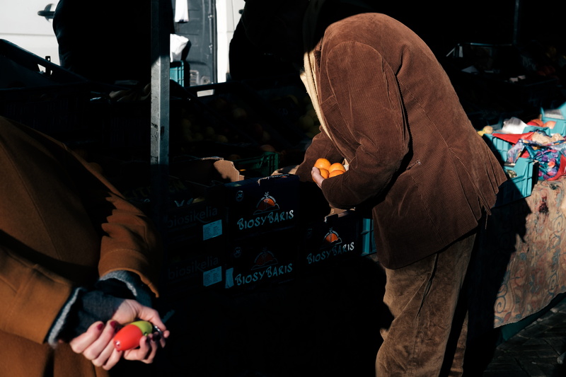 communication, adult, light, leisure activities, night life, street, holding, shop, arcade game machine, casual clothing, city, technology, real people
