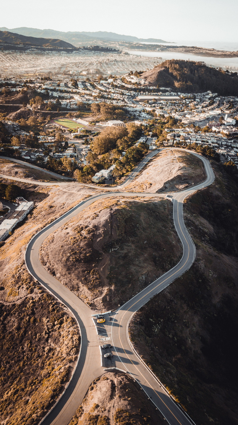 highway, mountains, roadway, aerial view, line, daylight, high angle view, no people, sky, city, birds eye view, scenics - nature, asphalt, transportation