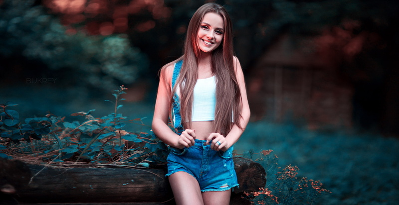 smiling, 720P, women, white tops, straight hair, short tops, suspenders, bokeh, long hair, open mouth, jean shorts, Kirill Bukrey, brown eyes, brunette