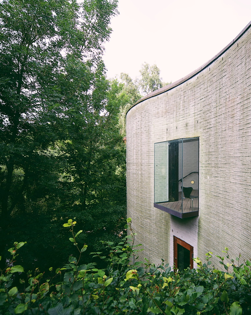 building exterior, wall - building feature, chair, leaf, sunlight, forest, wall, low angle view, vertical, museum, day, suspended, green color, outdoors