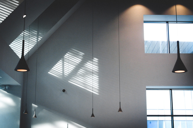 ceiling, white, glass - material, contemporary, room, no people, pendant light, shadow, sunlight, glass items, day, perspective, inside, hanging, empty