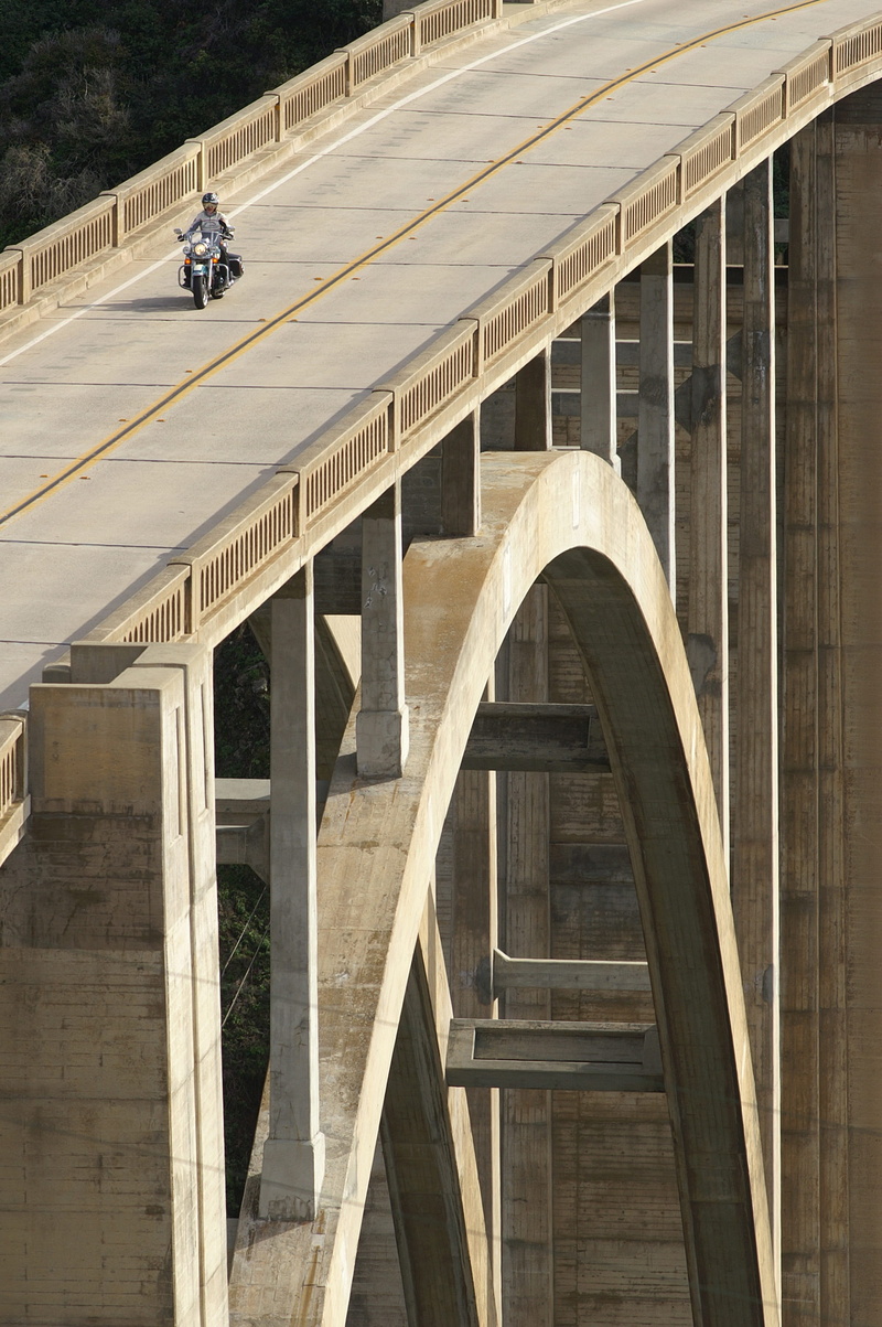 tarmac, structure, arch, asphalt, construction, built structure, roadway, land vehicle, motorbike, west coast, 2K, day, railing, roof, city, rider, driving