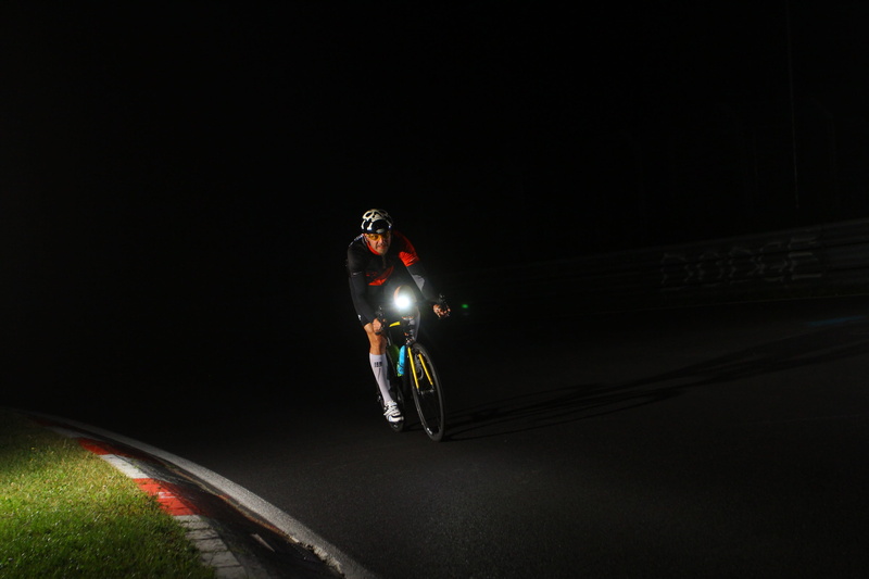 helmet, athlete, black background, motion, sports clothing, one person, night, mode of transportation, 2K, full length, riding, road, cycling, speed, on the move