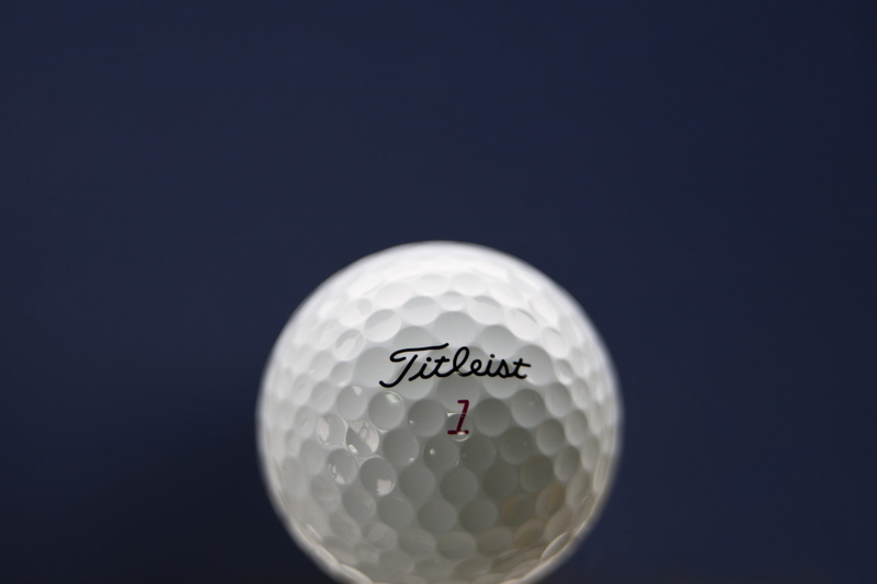 indoors, golf course, cut out, golf ball, ball, 2K, no people, copy space, sphere, studio shot, black background, close-up, sport, leisure activity, selective focus