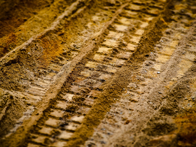 caterpillar tracks, tire tracks, selective focus, day, pattern, close, nature, close-up, field, tire track, tilt shift, outdoors, rural scene, dust, road