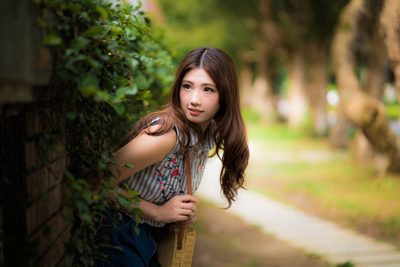 focus on foreground, brunette, one person, plants, fake iris, women, hair, Asian, portrait, striped clothing, looking at camera, three quarter length, casual clothing