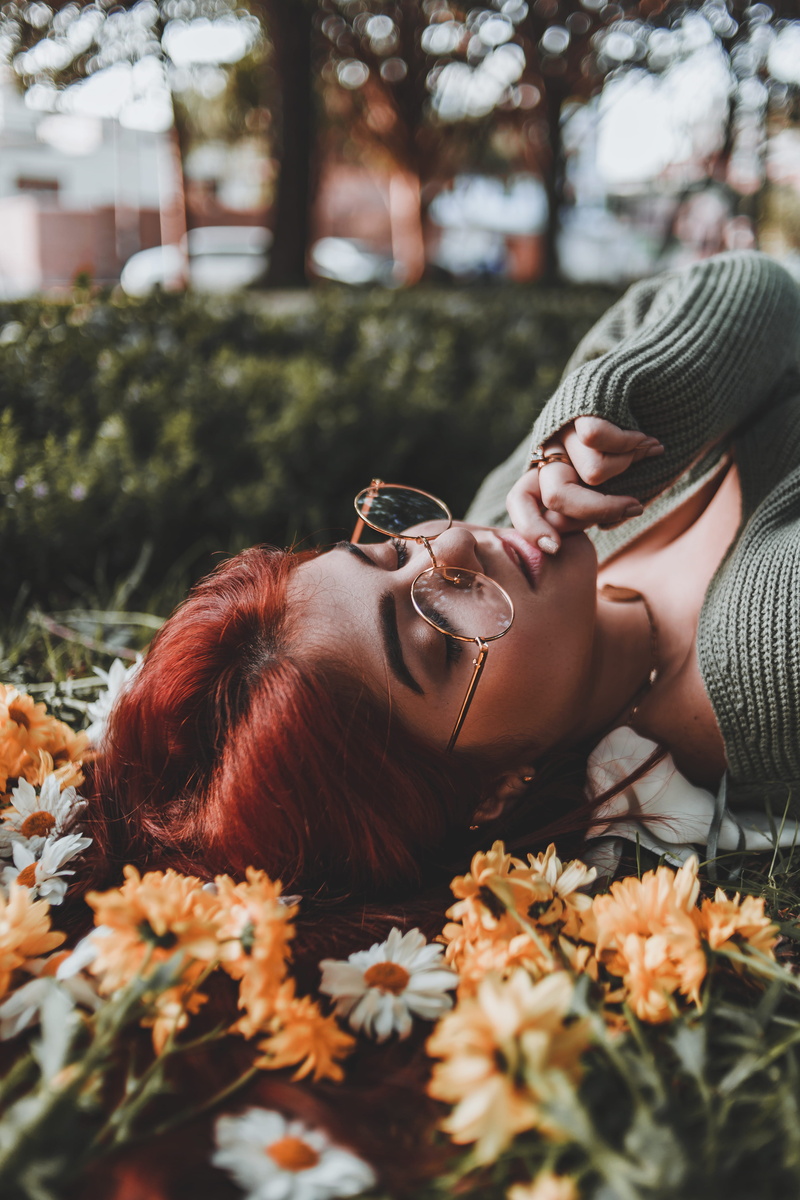 portrait, casual clothing, day, one person, hairstyle, leisure activity, lying down, right, fashion, outdoors, relaxation, style, smiling, finger, colors