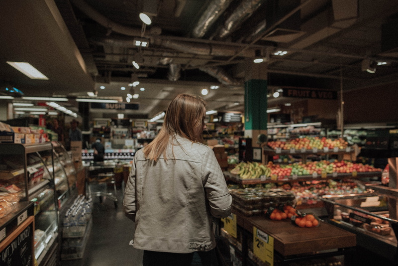 groceries, rear view, interior, food, candid, decisions, consumerism, person, teenager, three quarter length, standing, market, blur, choice, light, adult