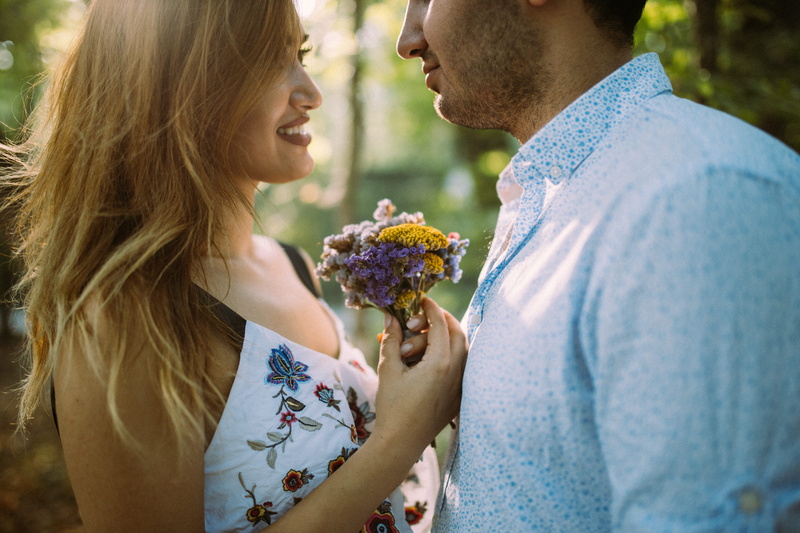 flowering plant, daytime, positive emotion, girlfriend, adult, person, closeup, flower arrangement, boyfriend, outdoors, smile, two people, man, woman