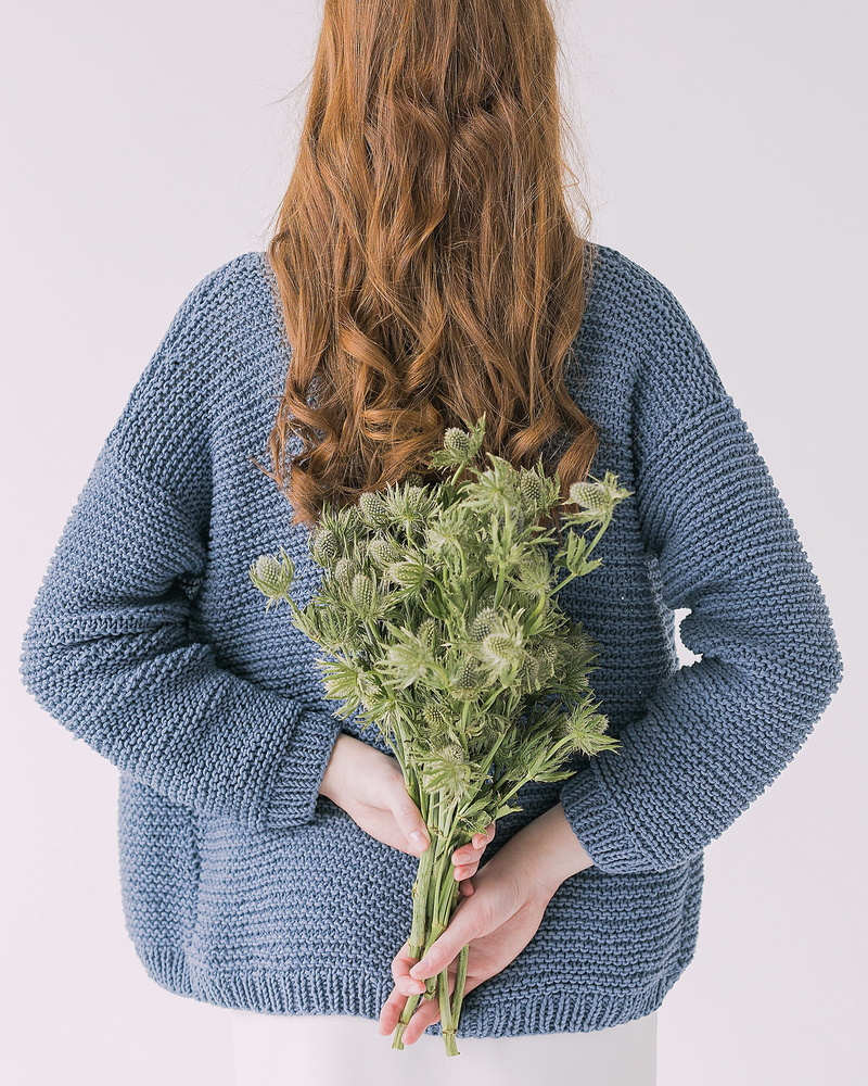 front view, hair, long hair, sweater, plants, woman, plant, adult, gray, flower, green, indoors, style, wear, human hair, hands, one person, standing, cut out