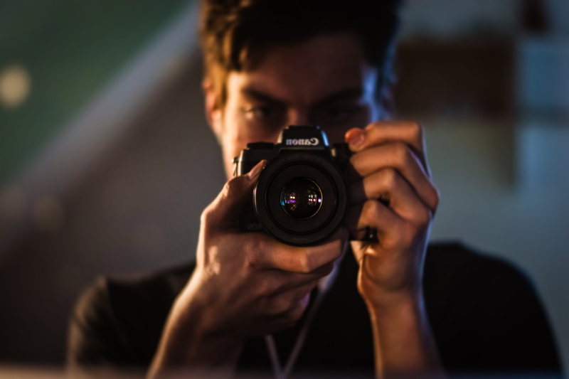 photography themes, slr camera, brown, photographer, photo, blur, mirror, camera gear, camera, one person, photography, human, face, person, photographic equipment