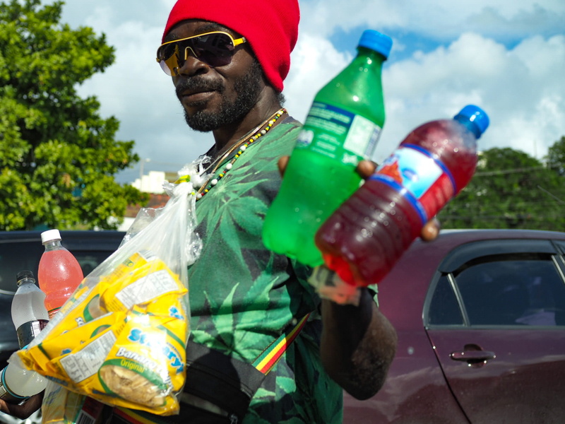 adult, security, standing, t, outdoors, bottles, day, transportation, labeled, bottle, waist up, focus on foreground, man, green, men, soda, safety, sprite