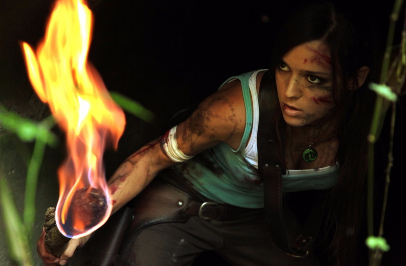 fire, torches, looking at camera, real people, women outdoors, Lara Croft, one person, flame, fire - natural phenomenon, long hair, young adult, casual clothing