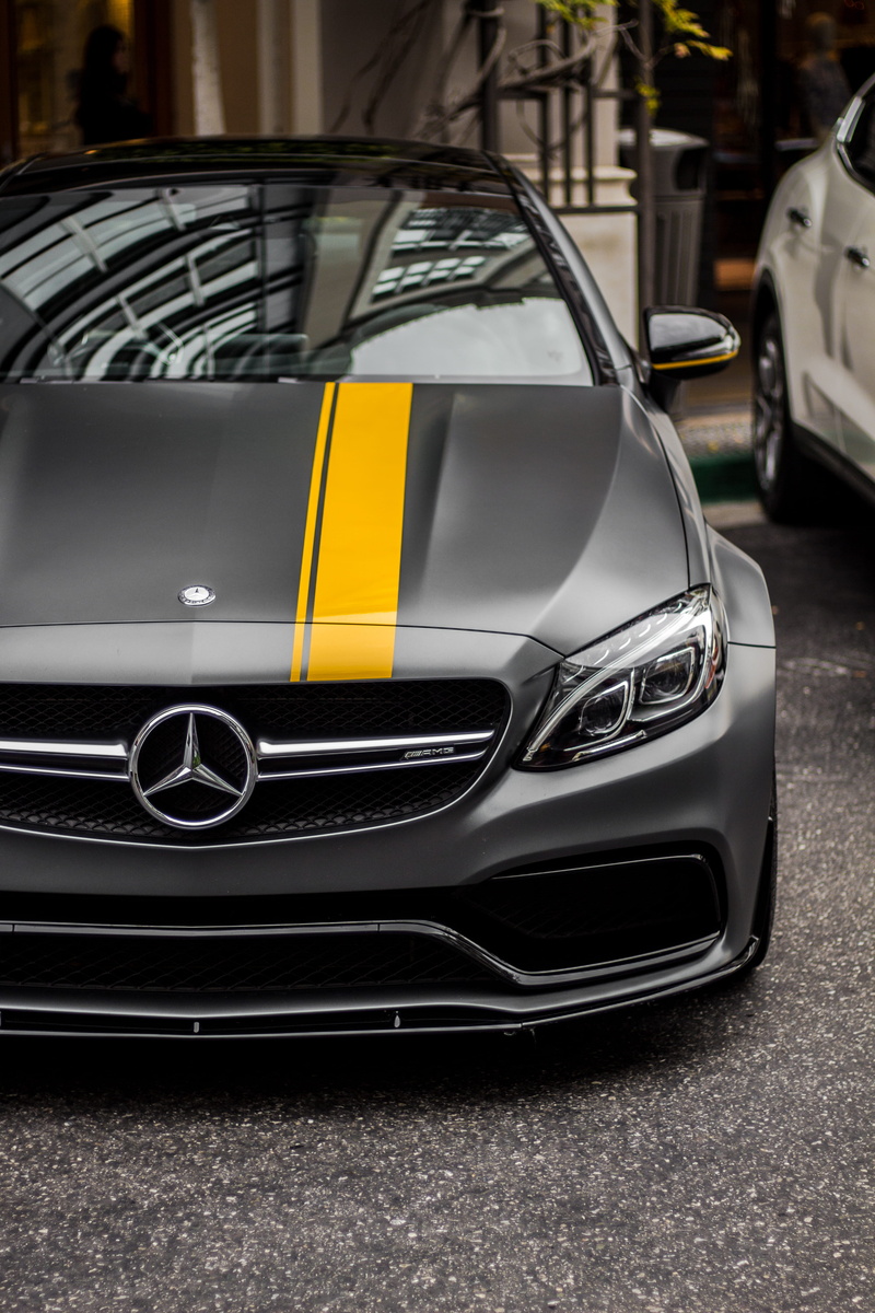 black, outdoors, sports car, parked, daytime, wealth, stationary, amg, gray, consumerism, c, car, close-up, reflection, photo, focus on foreground, headlight