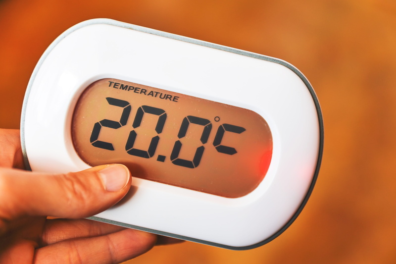 single object, text, people, studio shot, message, indoors, heat, human body part, hand, portable information device, focus on foreground, business, holding
