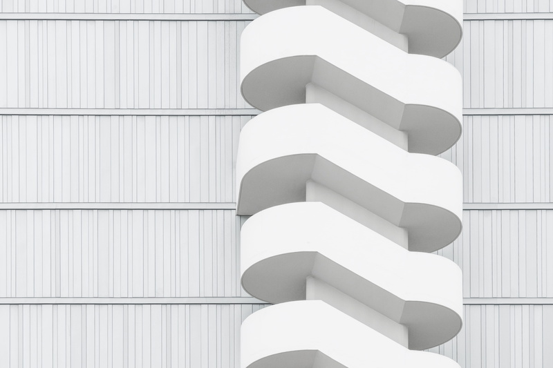 no people, close-up, grey, pattern, architecture, in a row, wooden, illuminated, stairwell, building, indoors, spiral, built structure, minimalistic, group of objects
