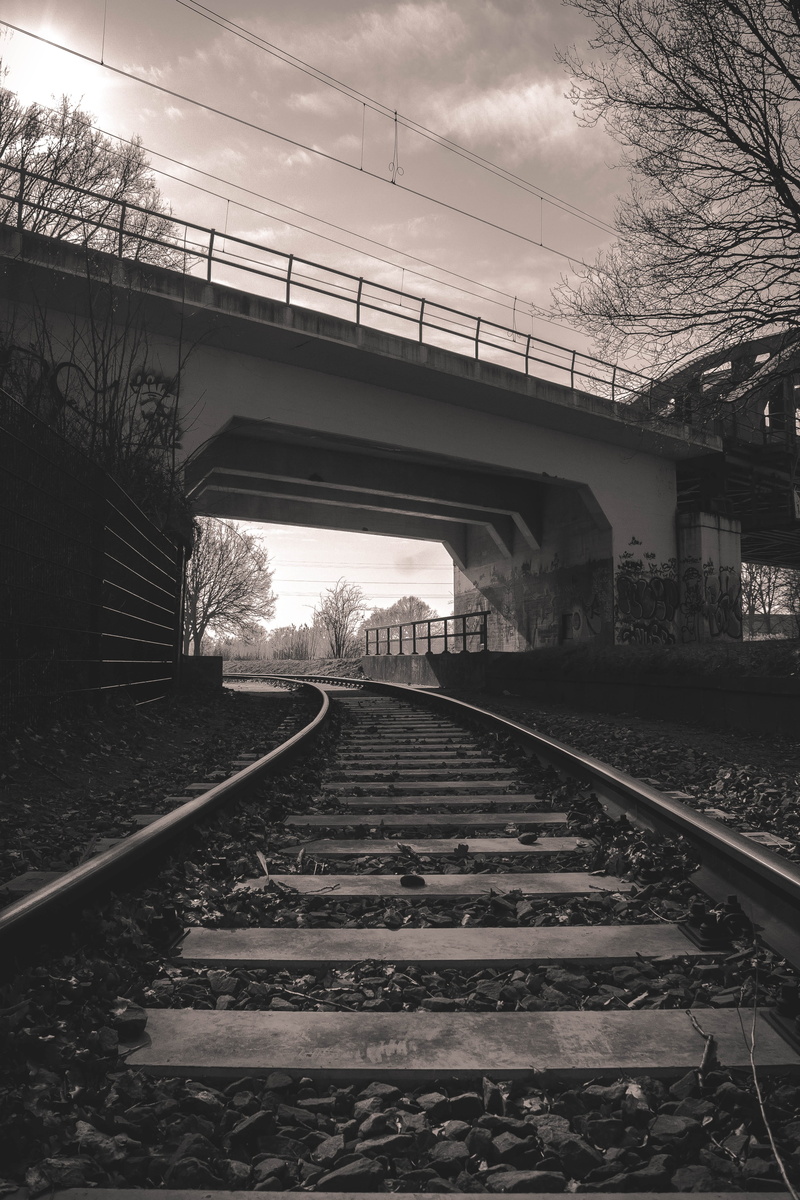 exploration, railway, direction, track, outdoors, parallel, tree, stone, no people, diminishing perspective, dark, long, bridge, bricks, gravel, wire, day