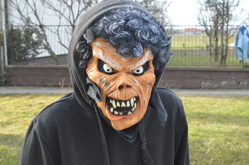 close-up, lifestyles, making a face, day, anger, Festival, mask - disguise, horror, disguise, one person, front view, looking at camera, black color, Carnival