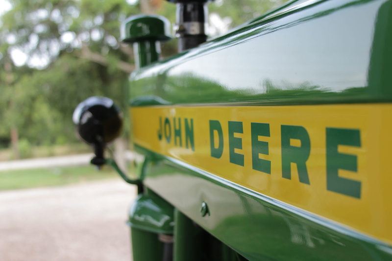 Green, city, Tractor, John Deere, outdoors, motor vehicle, day, tractor, yellow, green, road sign, communication, text, police force, security, mode of transportation