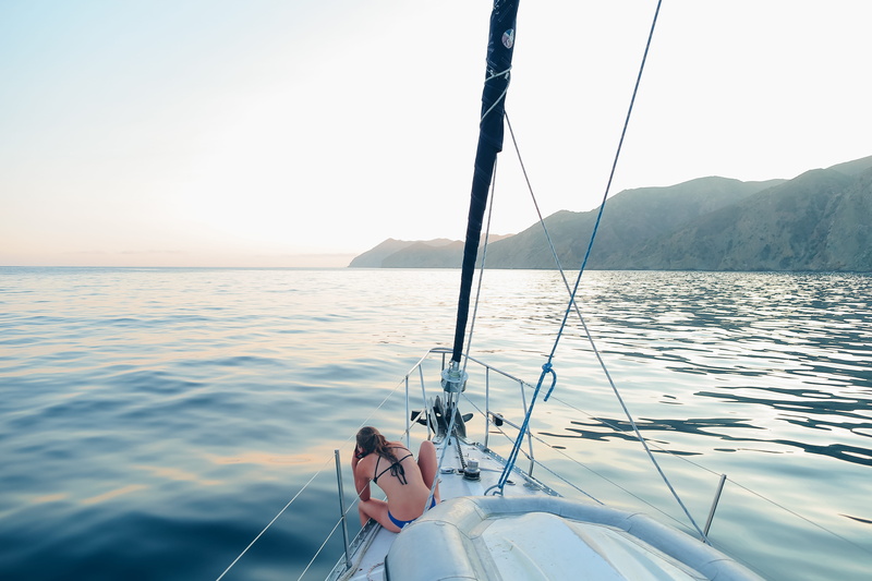 luxury, action, nautical Vessel, adult, sitting, outdoors, beauty in nature, blue, travel, caucasian Ethnicity, vacations, woman, relaxation, yacht, sports And Fitness