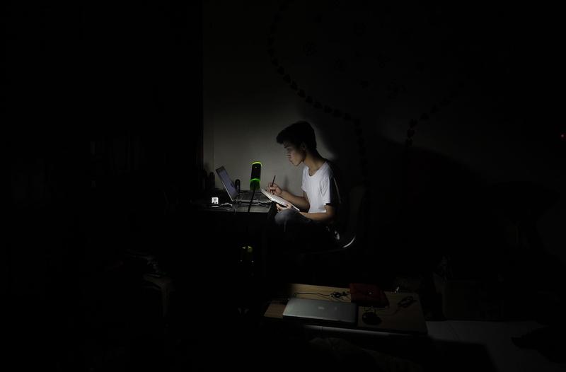 standing, amazing, dark, hairstyle, connection, adult, night, concentration, table, real people, web, design, lighting equipment, illuminated, designer